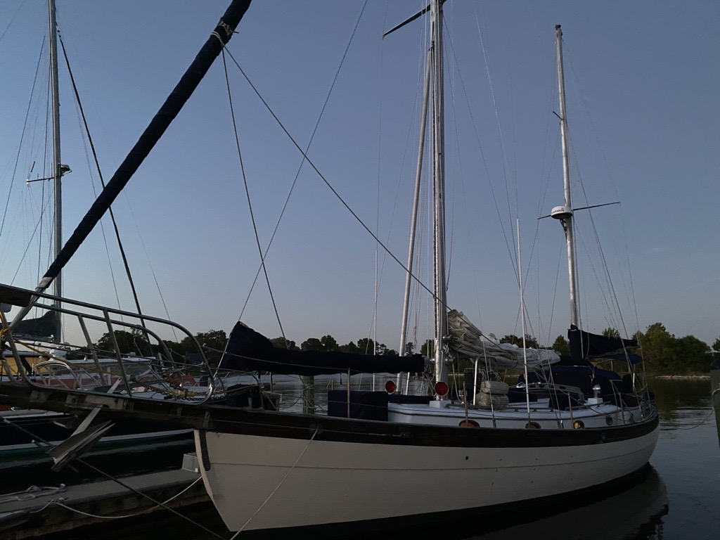 Nueva Vida 1979 Hans Christian 43 ketch broadside profile at dock, both masts and ketch rig visible at dusk
